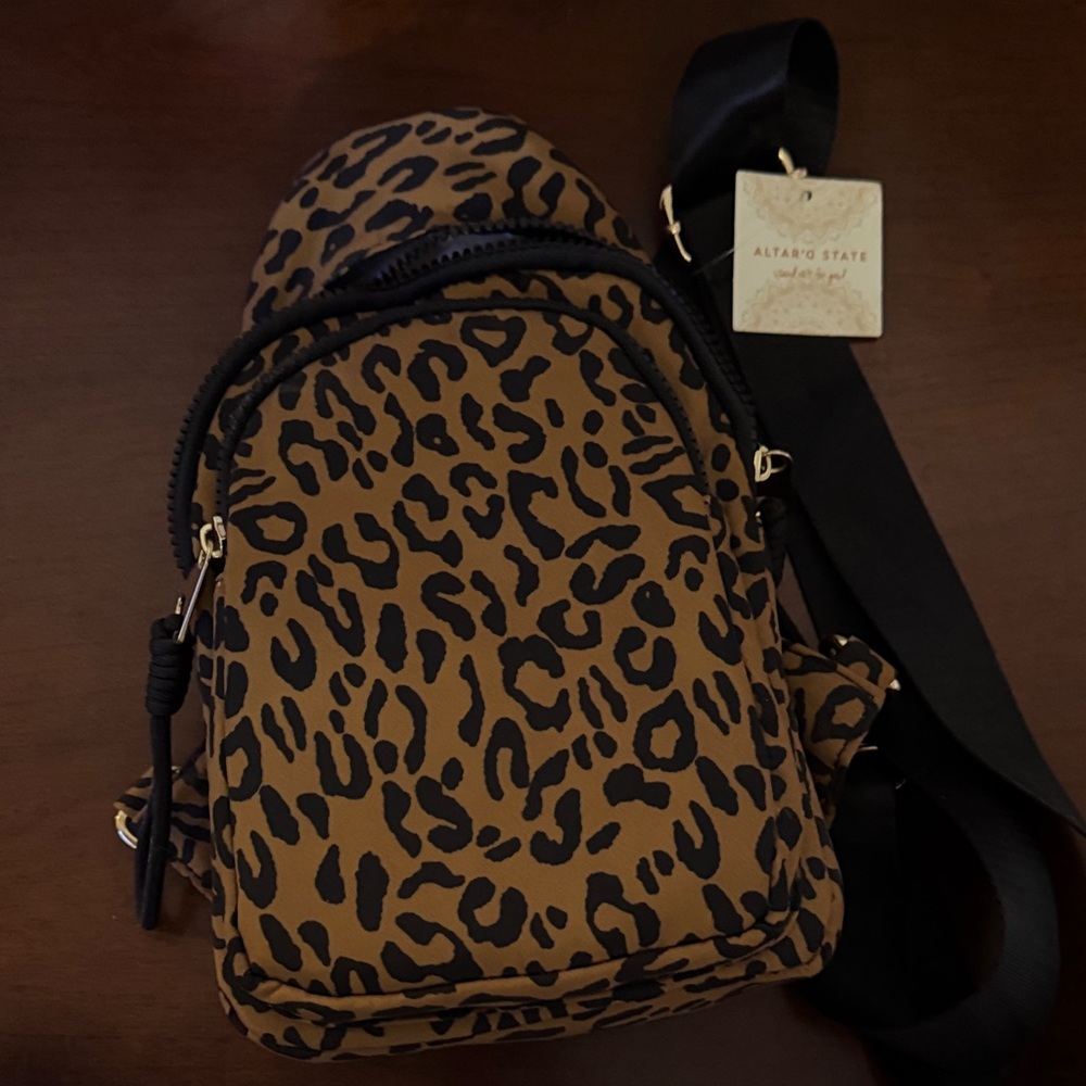 Altar'd State Brown Leopard sling backpack